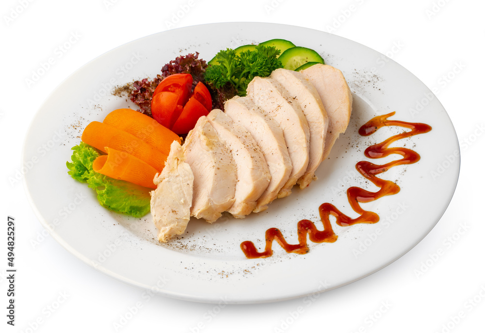 Pieces of boiled chicken breast with vegetables over white background Pieces of boiled chicken breast with vegetables over white background