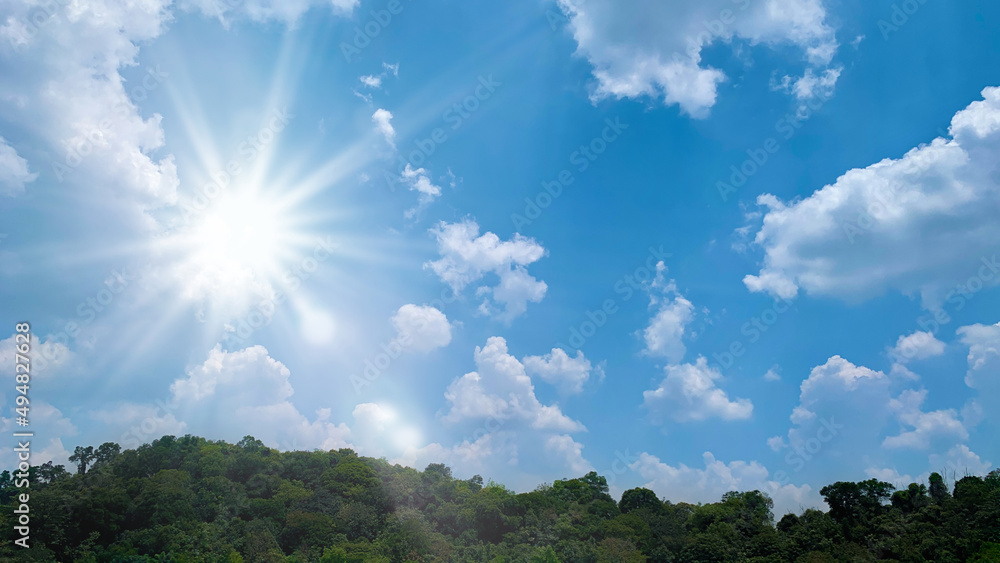 Close up of bright shining sun on blue sky. Nature concept Close up of bright shining sun on blue sky. Nature concept