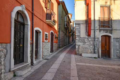 A narrow street among the old stone houses of Taurasi  town in Avellino province  Italy.