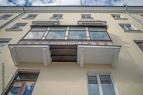 Fragment of the facade of a four-storey residential building © vladimir subbotin