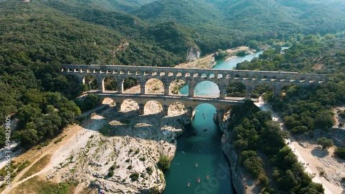 The Pont du Gard is an ancient Roman aqueduct bridge built in the first century AD. It crosses the river Gardon in southern France. Seen from above. photo