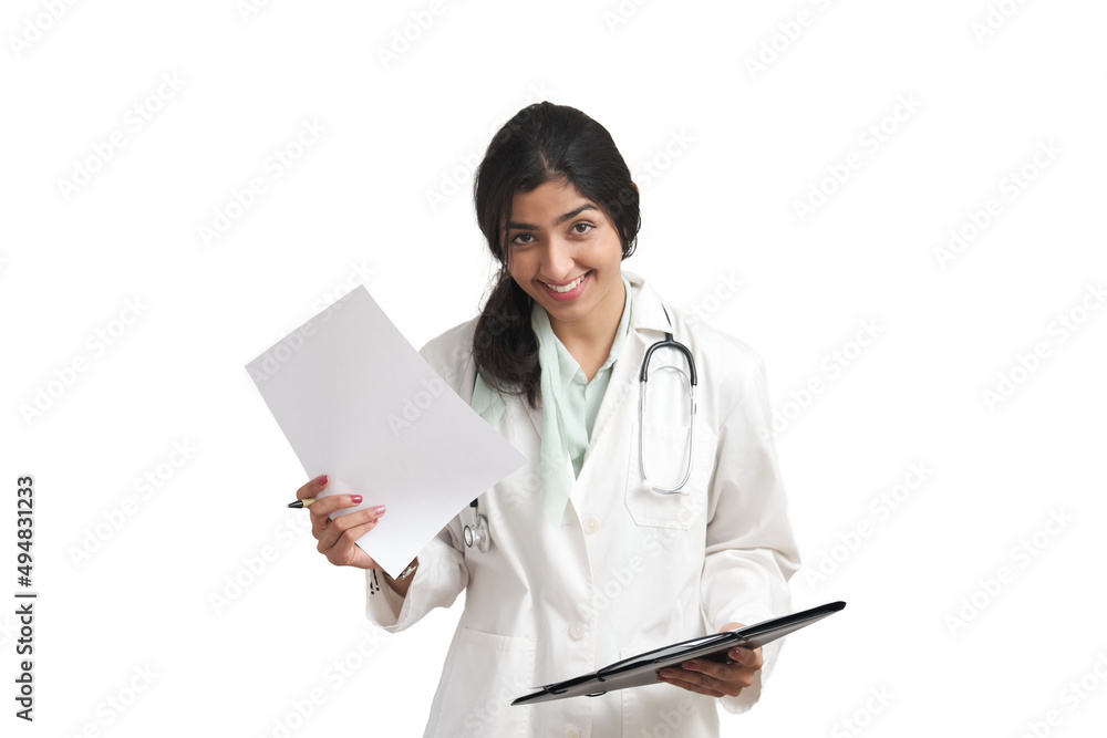 Young Venezuelan female doctor holding a medical report smiling and looking at camera. Isolated over white background. Young Venezuelan female doctor holding a medical report smiling and looking at camera. Isolated over white background.