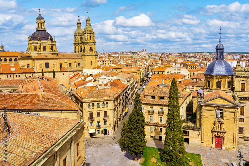 Cityscape of the medieval city of Salamanca with its old stone buildings.