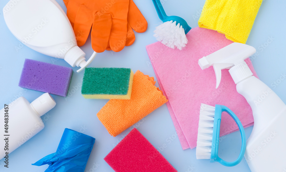 Many different bottles with detergents and cleaning tools Many different bottles with detergents and cleaning tools