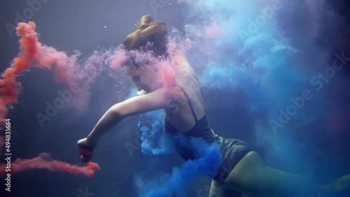 Wallpaper Mural artistic underwater shot with amazing graceful lady and blue and pink paints, swaying mist in depth Torontodigital.ca