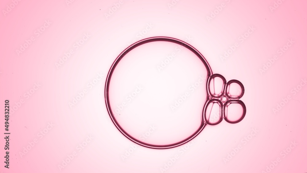 Macro shot of bubble with attached to it cluster of four small bubbles against pink background | Shot of skincare cream ingredients and hyaluronic acid concept Macro shot of bubble with attached to it cluster of four small bubbles against pink background | Shot of skincare cream ingredients and hyaluronic acid concept