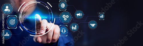 Young businessman working on a virtual screen of the future and sees the inscription: Customization