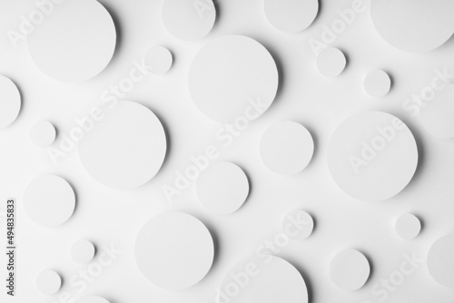 White simple geometric background with circles in soft light as softness tender airy pattern, top view. Futuristic minimal backdrop for advertising, design.