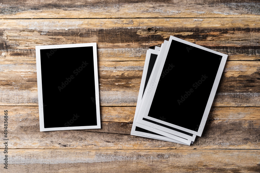 Blank photo frames for your photos on wooden background Blank photo frames for your photos on wooden background