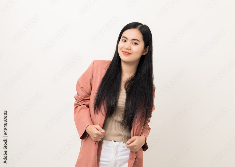 Beautiful asian women in pink fashion suit standing pose looking at camera. Attractive female portrait in white studio. Smiling woman age around 20 Beautiful asian women in pink fashion suit standing pose looking at camera. Attractive female portrait in white studio. Smiling woman age around 20