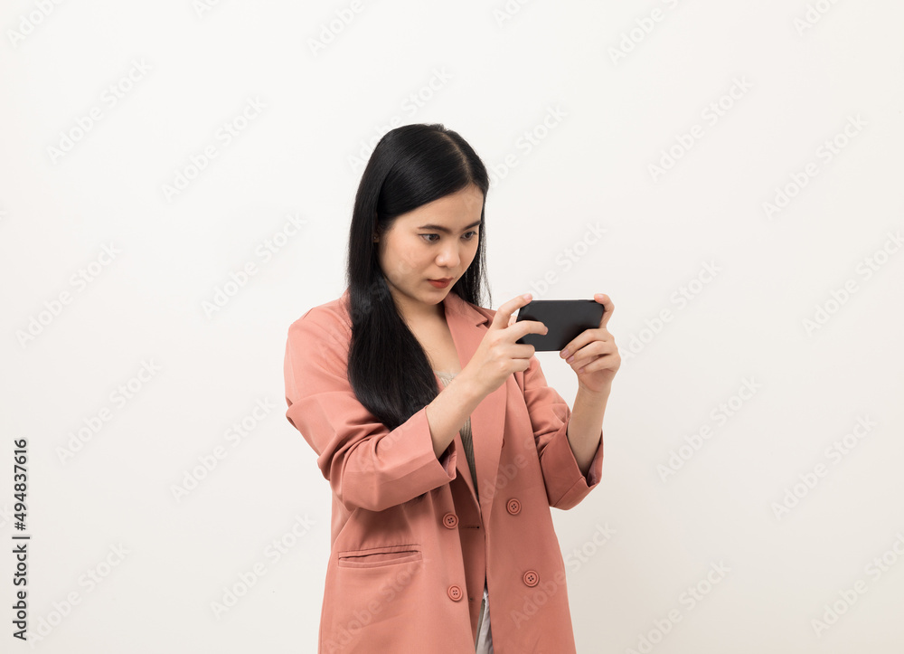 Cheerful young Asian woman using smartphone and checking message on mobile chat application isolated white background. Fashion style asian lovely woman playing game or shopping online by cellphone Cheerful young Asian woman using smartphone and checking message on mobile chat application isolated white background. Fashion style asian lovely woman playing game or shopping online by cellphone