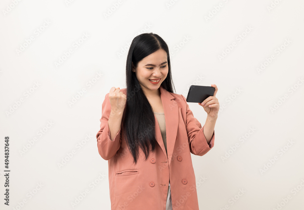 Cheerful young Asian woman using smartphone and checking message on mobile chat application isolated white background. Fashion style asian lovely woman playing game or shopping online by cellphone Cheerful young Asian woman using smartphone and checking message on mobile chat application isolated white background. Fashion style asian lovely woman playing game or shopping online by cellphone