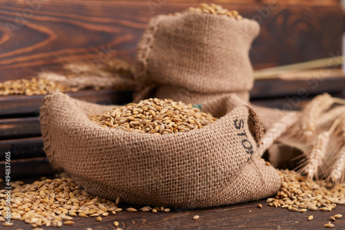barley grain on the wooden background © fox17