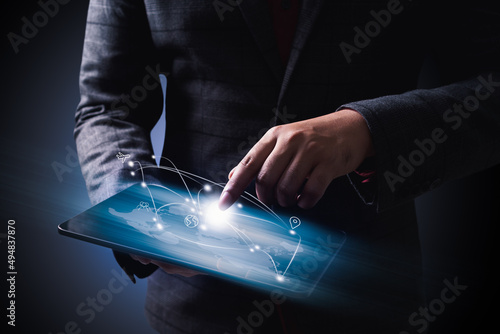 Businessman Holding Digital Tablet With digigal transportaion  Icons photo