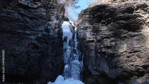 Paraeso Falls in South Korea near Ulsan city. Frozen waterfall in winter photo