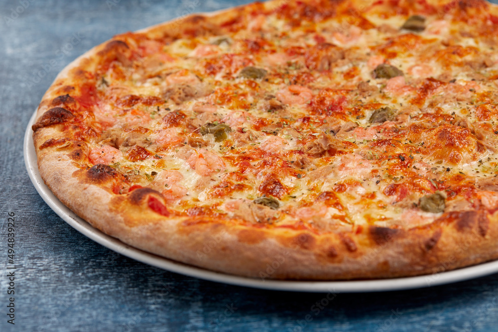 pizza on the wooden background