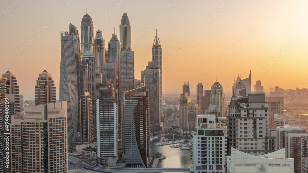 View of various skyscrapers in tallest recidential block in Dubai Marina aerial timelapse