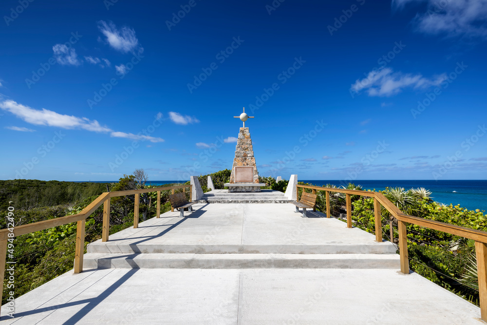The Christopher Columbus monument at the north cape of Long Island, Bahamas, surrounded by mangroves and blue sea