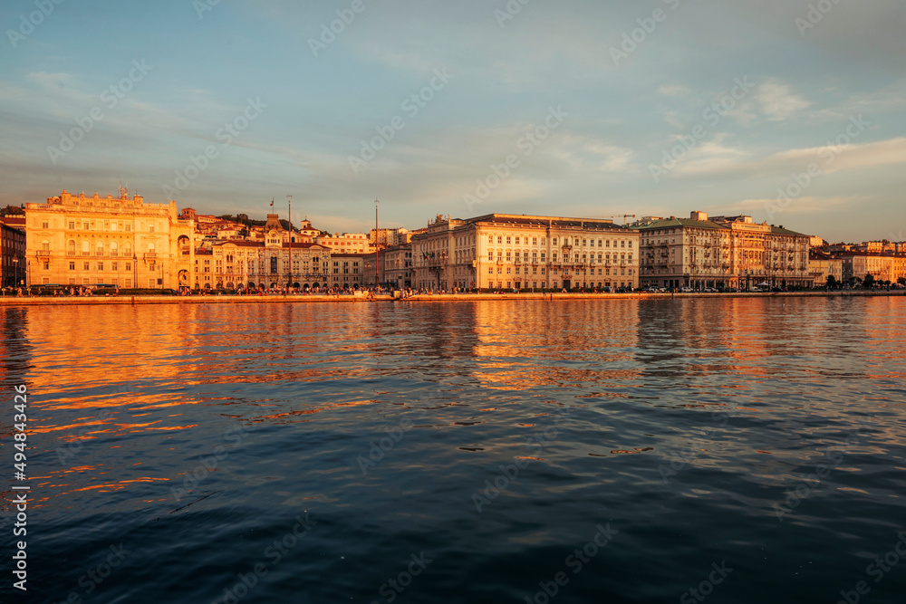view of the city of trieste in italy at sunset