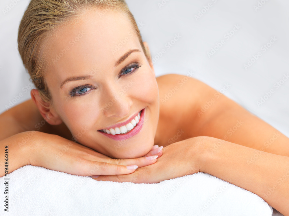 Feeling relaxed and naturally gorgeous. A beautiful young woman relaxing in a spa -copyspace.