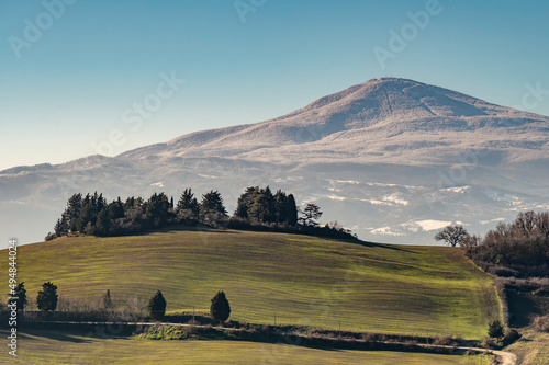 View of Monte Amiata covered by snow from the Monticchiello area, Siena, Italy photo