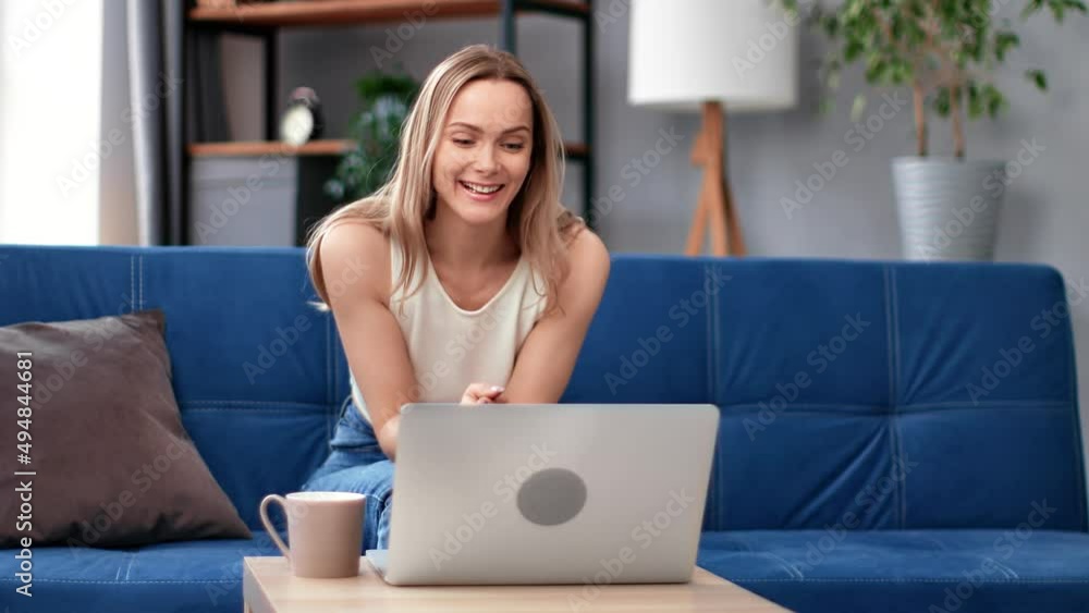 Lucky blonde woman having good news received success online message email e learning Lucky blonde woman having good news received success online message email e learning