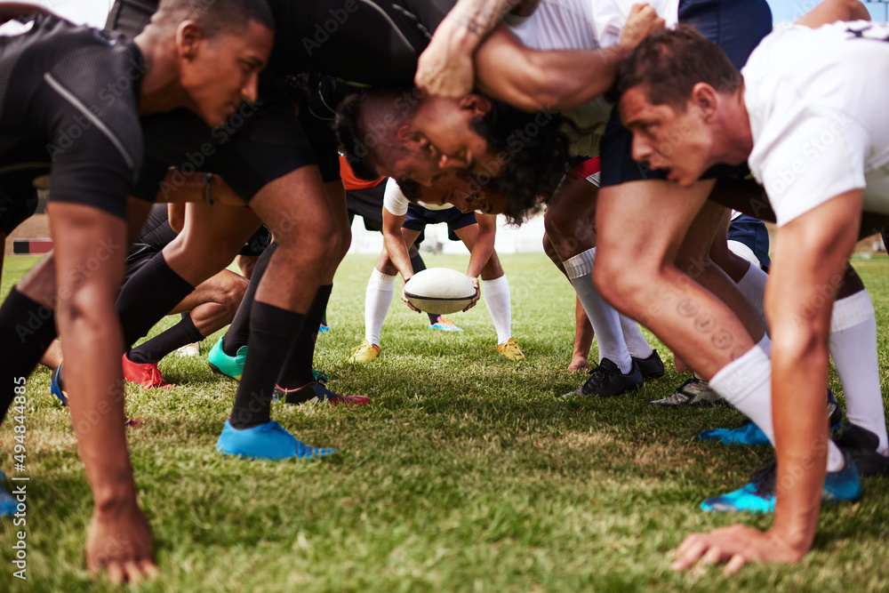 The battle begins. Shot of a group of young rugby players in a scrum on the field. The battle begins. Shot of a group of young rugby players in a scrum on the field.
