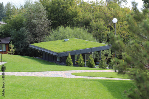 A modern village with turf roofs. Scandinavian type of green roof covered with sod on top.