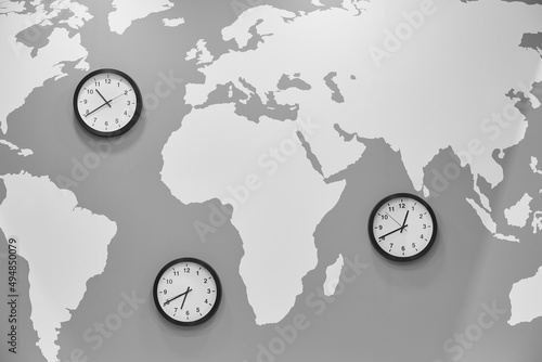 Clocks in a world map. Global time. Travel and business
