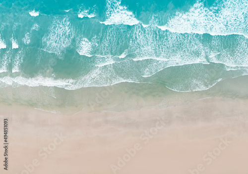Aerial top view of the beach wave on tropical sea in summer background