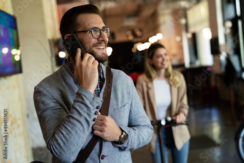 Businessman in office. Handsome businessman talking to the phone