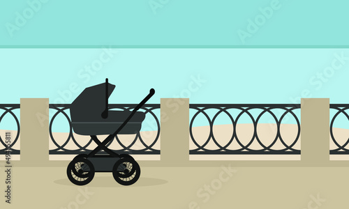 Baby stroller on the embankment