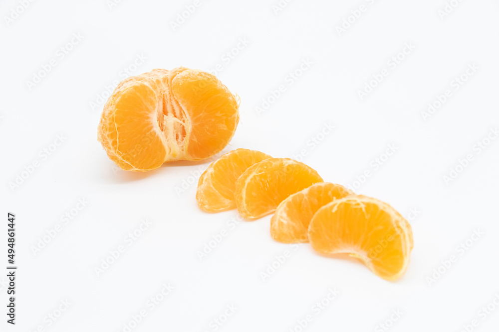some slices of tangerine or komola isolated on white background, some slices of tangerine or komola isolated on white background,