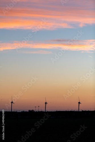 Wind turbines at sunset in France