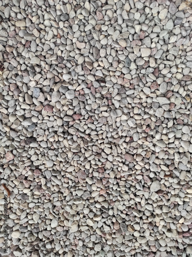 Full frame natural background of light colored small pebbles Full frame natural background of light colored small pebbles