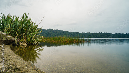 Scenic view of tranquil Lanthe Lake in New Zealand under a cloudy sky photo