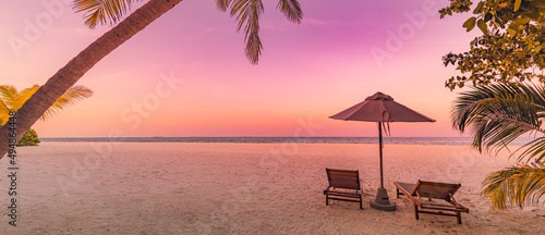Fototapeta Naklejka Na Ścianę i Meble -  Beautiful beach panorama. Chairs on the sandy beach at seaside. Summer holiday vacation for couple tourism. Amazing tropical landscape. Tranquil scenic, relaxing beach tropical landscape, island shore