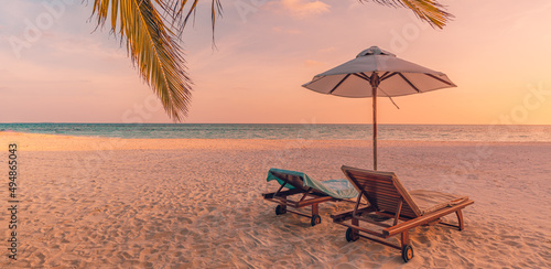 Fototapeta Naklejka Na Ścianę i Meble -  Beautiful beach panorama. Chairs on the sandy beach at seaside. Summer holiday vacation for couple tourism. Amazing tropical landscape. Tranquil scenic, relaxing beach tropical landscape, island shore