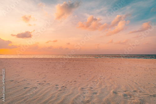 Closeup sea sand beach. Amazing empty beach landscape. Inspire tropical island seascape horizon. Orange golden purple sunset sunrise sky tranquil sunlight. Summer vacation travel holiday copy space © icemanphotos