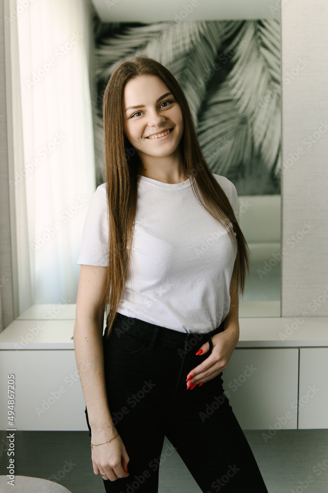Attractive young Russian girl manicure master, professionally does manicure and nail polish, beauty salon, portrait of the master, selective focus Attractive young Russian girl manicure master, professionally does manicure and nail polish, beauty salon, portrait of the master, selective focus