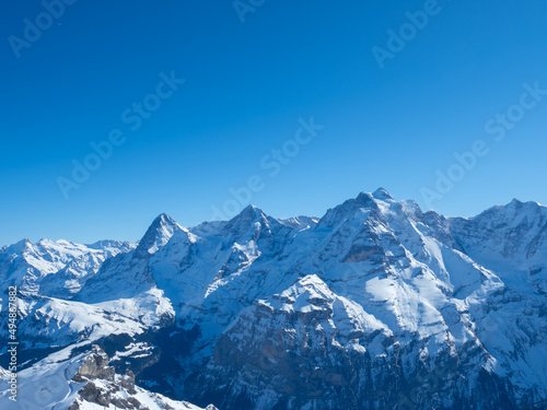 Winter view from Schilthorn peak, Switzerland, towards the famous mountains Eiger, Moench, and Jungfrau