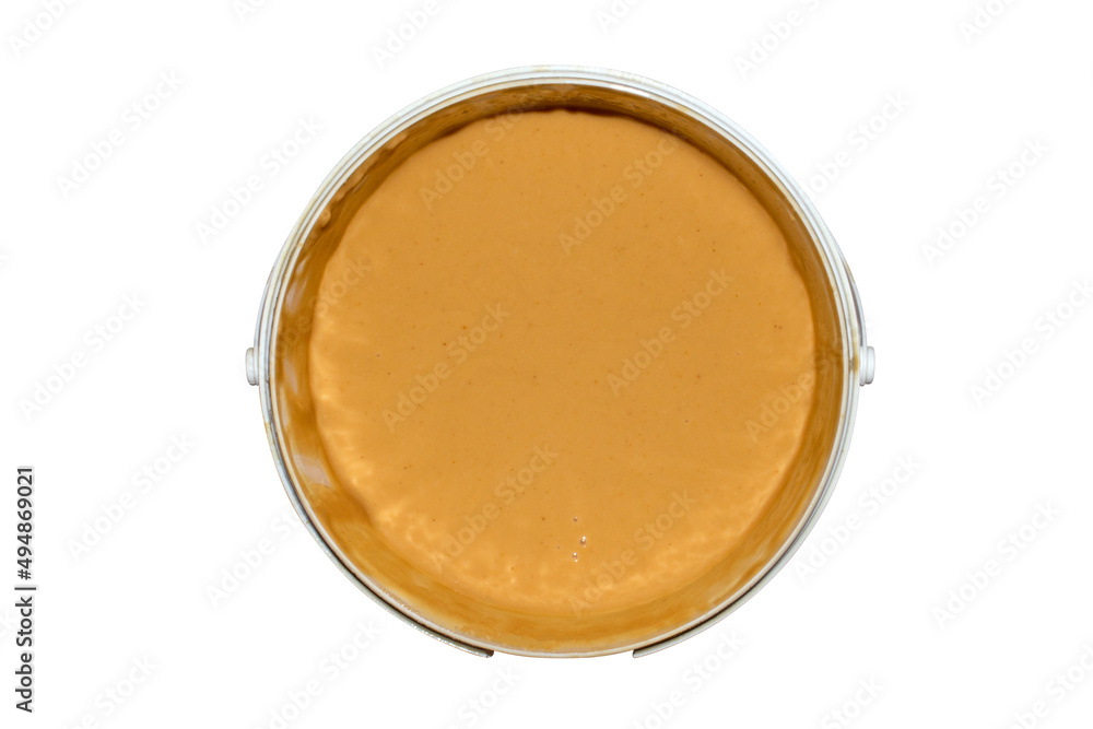 Peanut paste in a container on a white background top view.Peanut butter made from whole nuts. Peanut paste in a container on a white background top view.Peanut butter made from whole nuts.