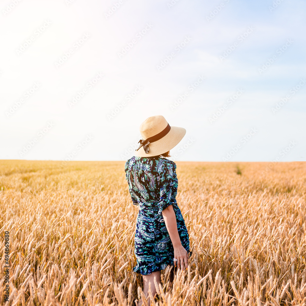 Beautiful girl in a wheat field