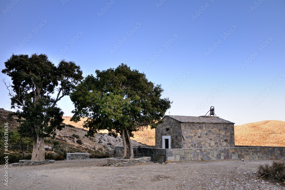 Small stone chapel at Nida Plateau. Blue sky. Crete island, Greece.