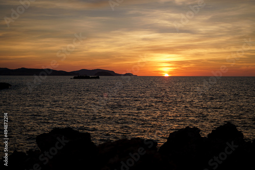 Cala Viola de Ponent  Menorca. September 2021. Magnificent sunset in the Mediterranean Sea. On one of the paradisaical beaches of the island of Menorca.
