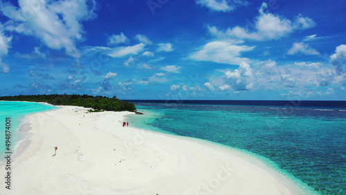 Group of women on the beach in Fulhadhoo Island, The Maldives photo