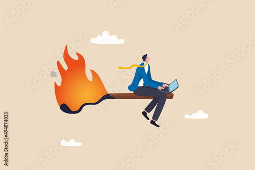 Burnout from overworked or pressure to finish within deadline, frustration or exhausted worker, despair employee or trouble concept, desperate businessman working with laptop on burning matchstick.