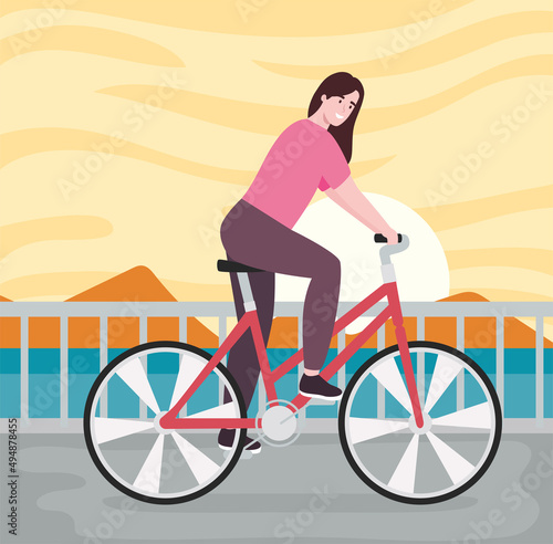 female cyclist in seascape