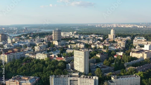 Aerial drone video of downtown skyline buildings and Dnipro river in Pecherskyi district of Kyiv Oblast Ukraine during sunset. Filmed on a summer day in August 2021 photo