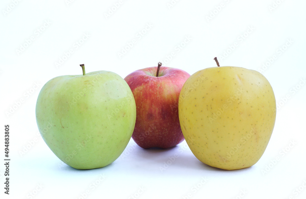 Red, yellow and green apples on a white background. Red, yellow and green apples on a white background.